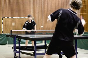 Two competitors playing a game of table tennis.